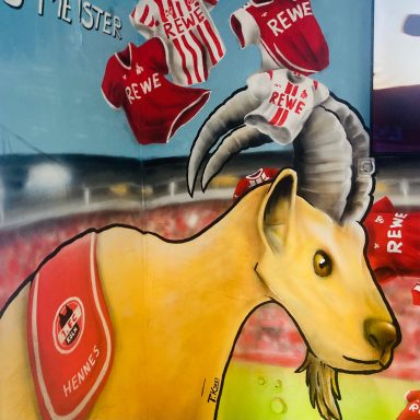 Wandgestaltung Graffiti Maskottchen "Hennes" des ersten FC Köln in Tankstelle Bad Honnef